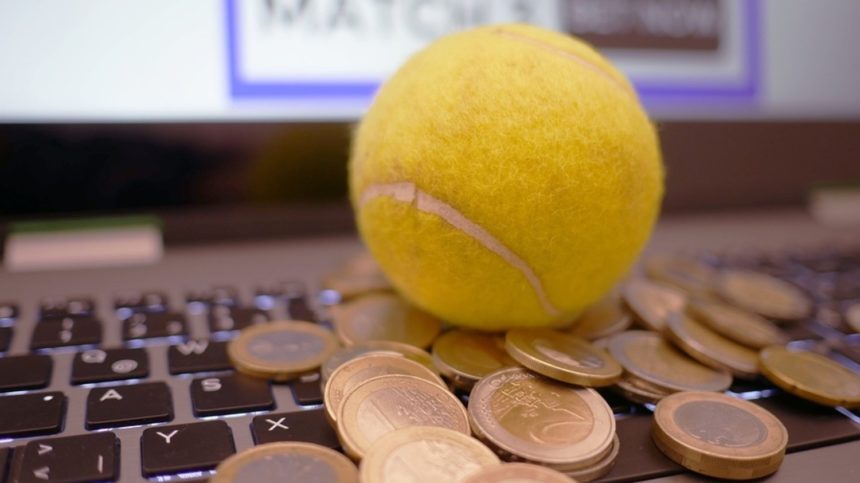 Teniska loptica i kovanice na laptopu (kako se kladiti na tenis)